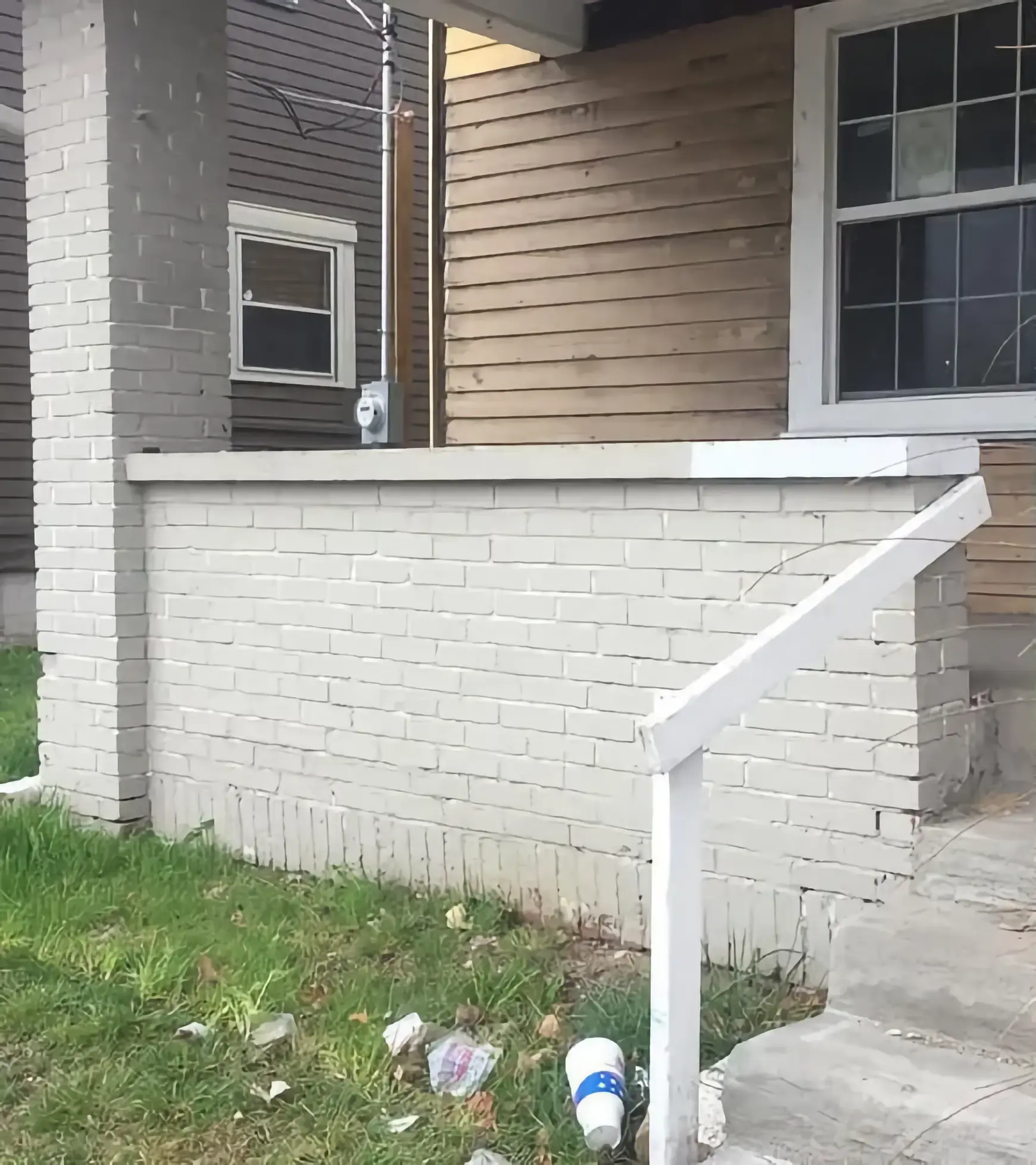Before: Front Porch Brick Wall Paint & Stain Removal